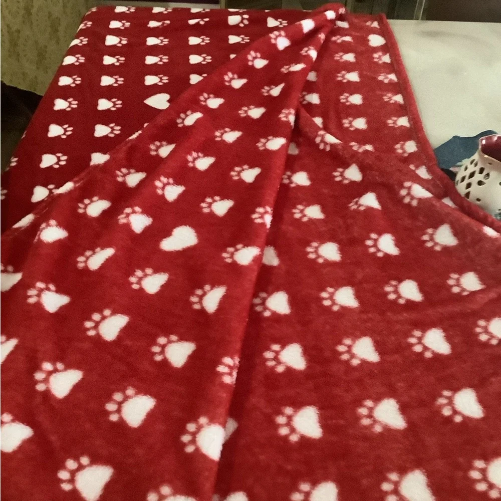 Doggie blanket a red & white with prints on it soft & cozy. 77”x50” clea…